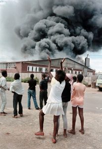 GraemeWilliamsBophutatswana Homeland, Garankuwa. 1990. A factory is set alight during demonstrations against the Bophutatswana government in Garankuwa.